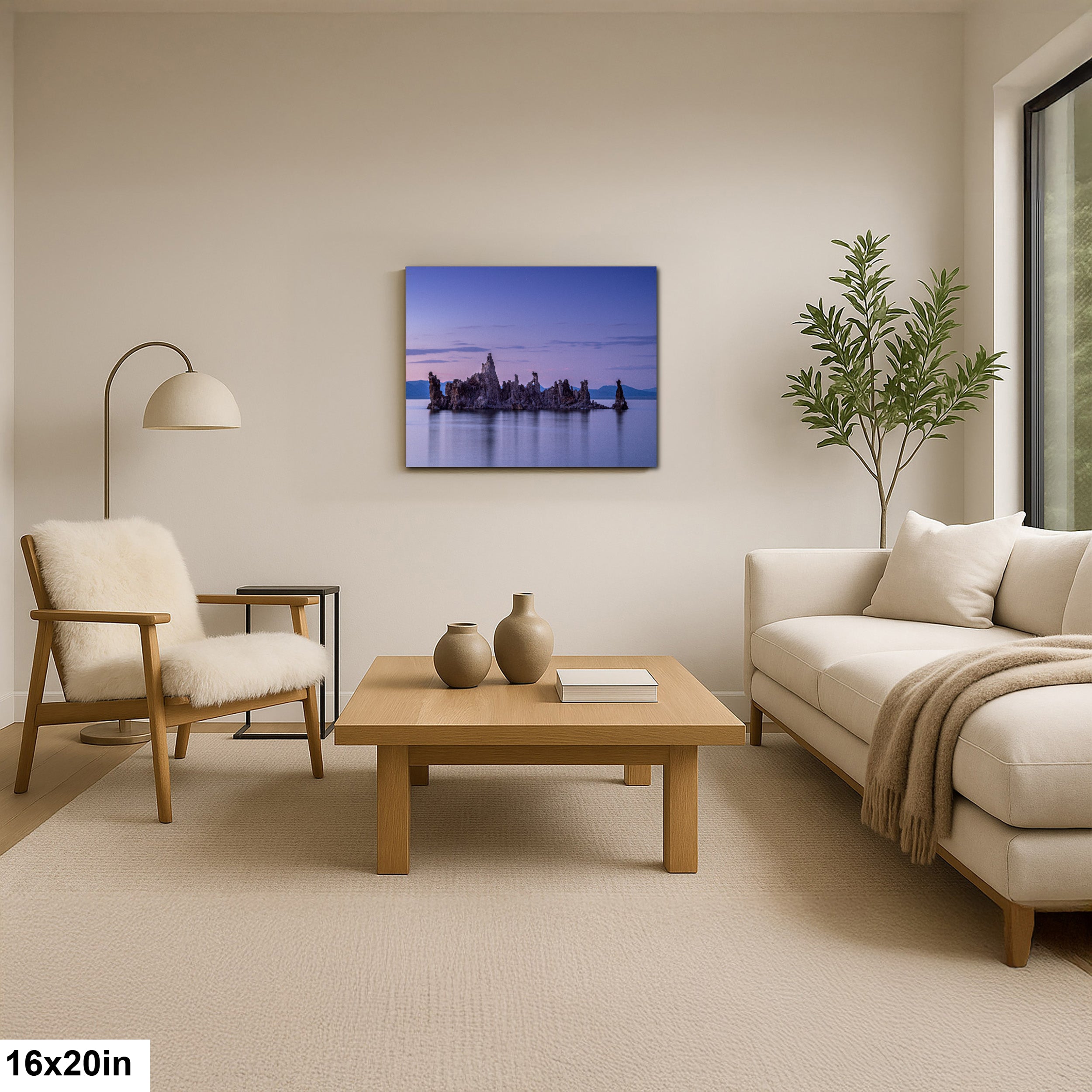 Photographer holding 16x20 inch Mono Lake twilight tufa towers print on neutral background.