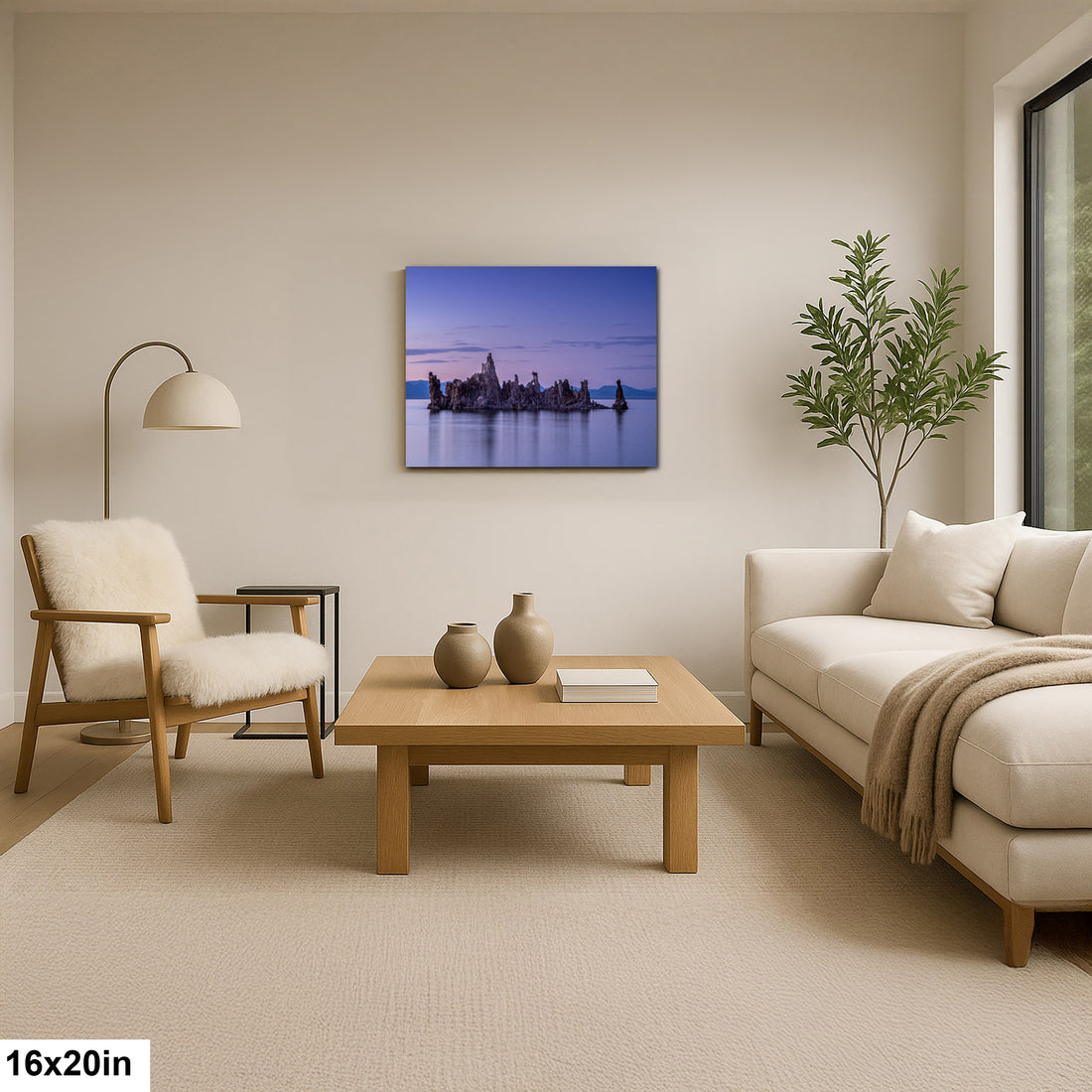 Photographer holding 16x20 inch Mono Lake twilight tufa towers print on neutral background.