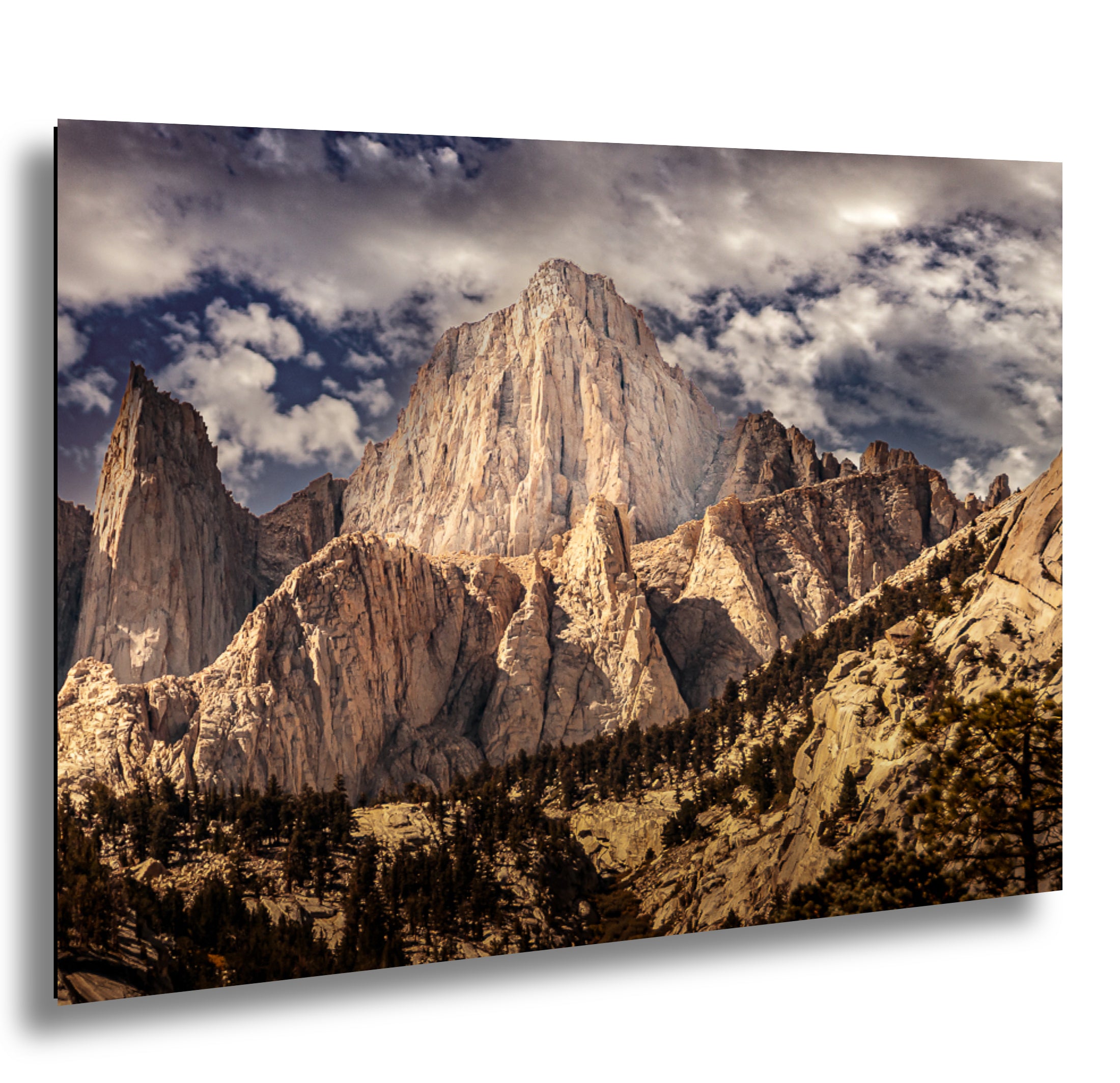 El Capitan granite monolith and Yosemite Valley rock formations with forest and dramatic cloudy sky landscape photography.