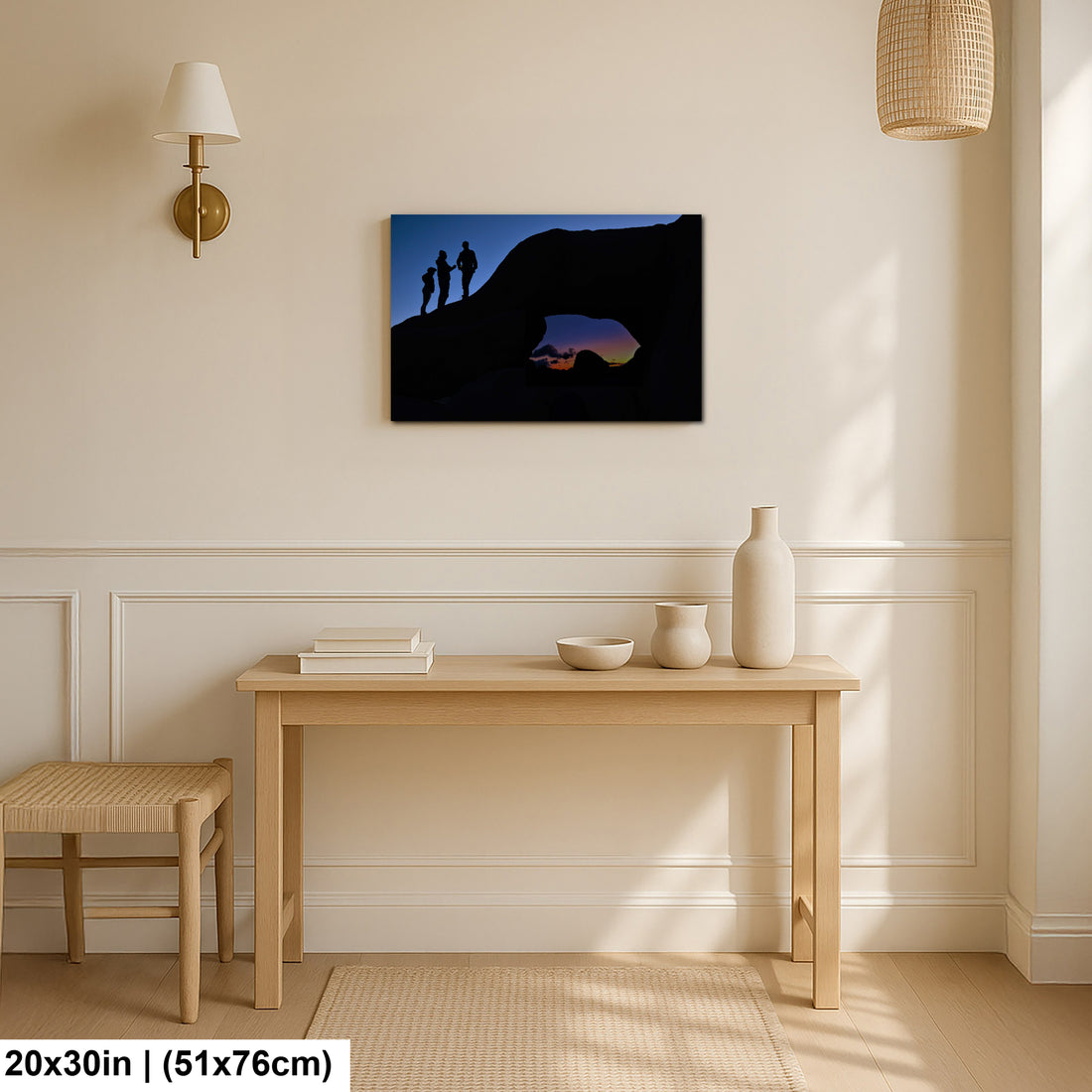 Silhouette of Arch Rock with silhoutte of people on top in Joshua Tree National Park
